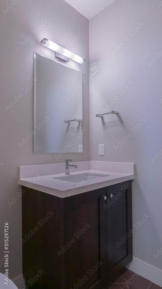 Vertical frame Small hand basin and mirror in a toilet Vertical frame Small hand basin and mirror in a toilet