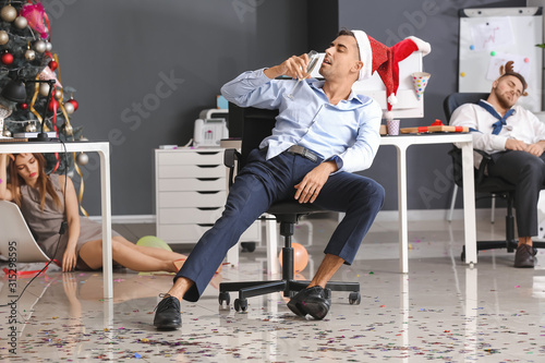 Young man with hangover aft...