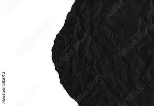dark black crumpled paper, fragment with shadow, torn edge background for design