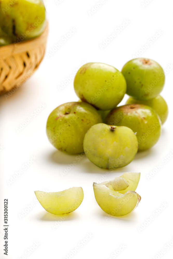 Fresh Indian gooseberry in wooden  bowl 