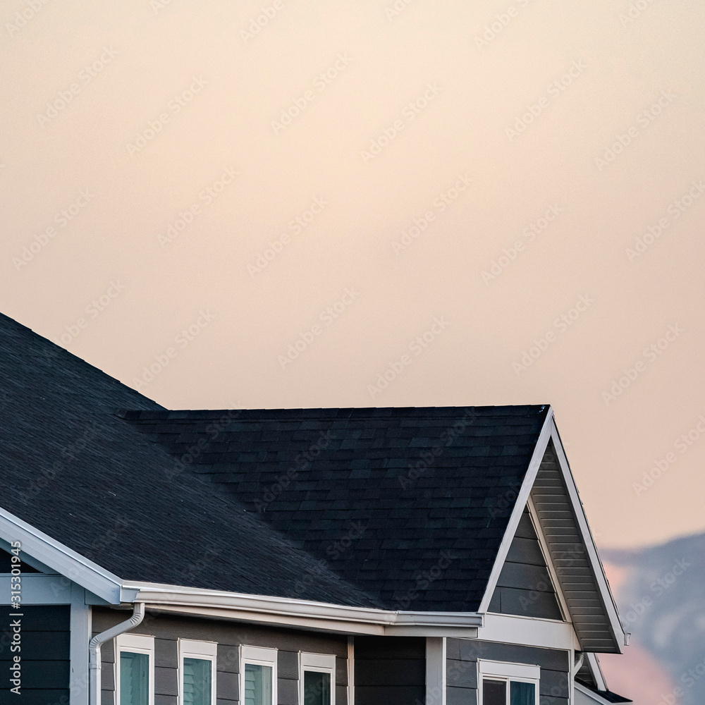 Fototapeta premium Square Cropped image of a house and mountain peak