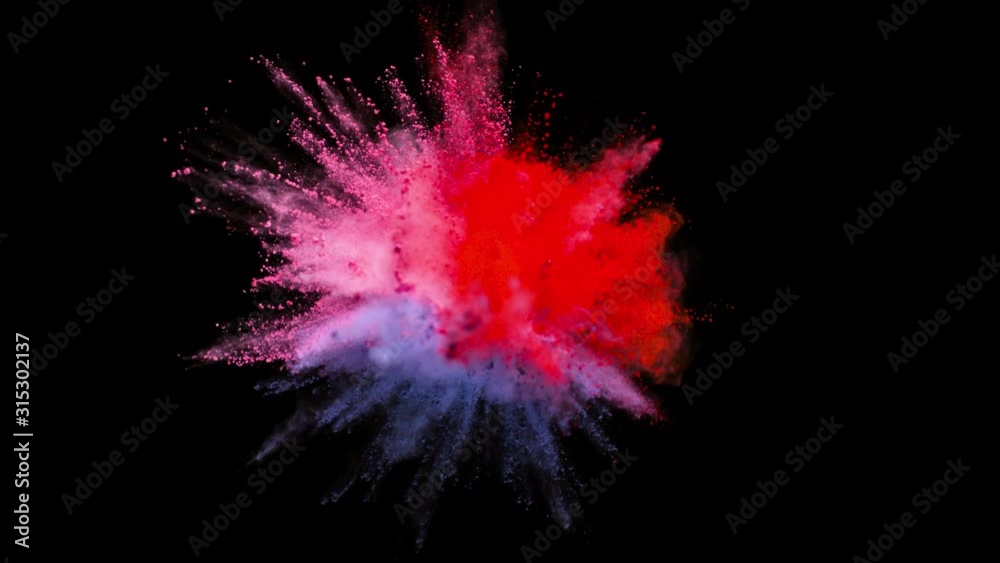 Colored powder explosion, abstract close up dust isolated on black background in slow motion