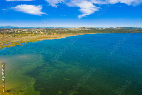 Aerial drone view of ornithological nature park, shore of Vrana lake (Vransko jezero) in Dalmatia, Croatia