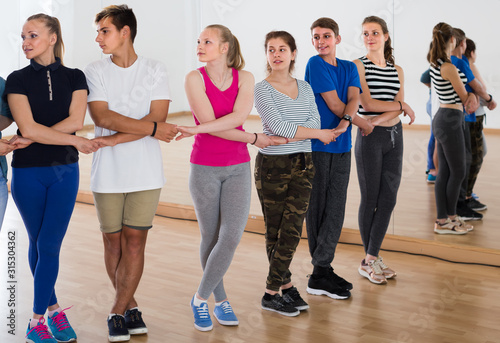 positive teens studying folk style dance