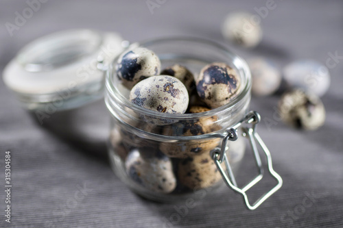 quail eggs in a glass jar with willow. Easter decoration of kitchen
