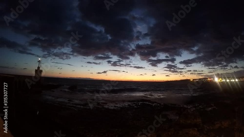 it is a  time lapse of the coast of the south of Italy. I made it during the Christmas holiday. the sky is full of clouds and when the sun came the sky take amazing colors photo