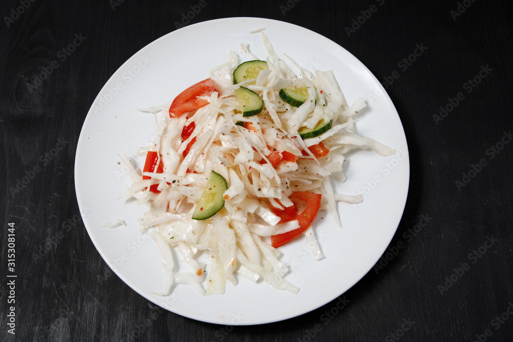 Plate with salad on the table. Plate with salad on the table.