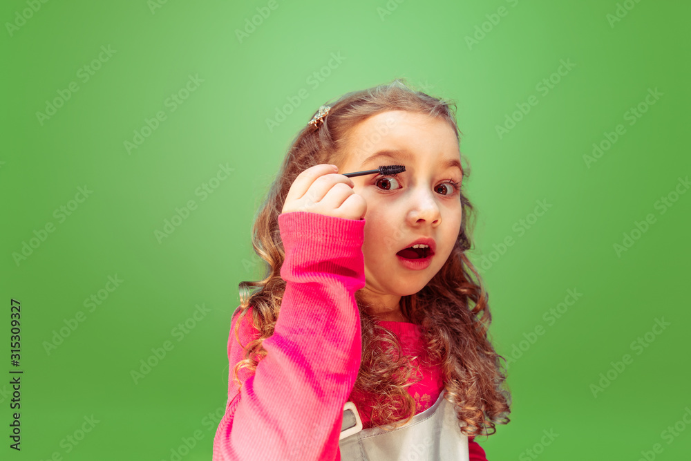 Pure view. Little girl dreaming about profession of makeup artist. Childhood, planning, education and dream concept. Wants to become successful employee in fashion and style industry, hairstyle artist Pure view. Little girl dreaming about profession of makeup artist. Childhood, planning, education and dream concept. Wants to become successful employee in fashion and style industry, hairstyle artist