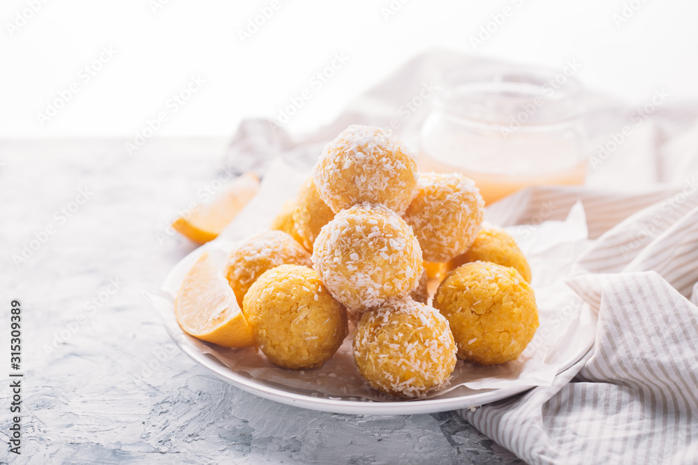 Homemade Raw Vegan Coconut and Lemon Truffles. Vegetarian food concept. Copy space. Homemade Raw Vegan Coconut and Lemon Truffles. Vegetarian food concept. Copy space.