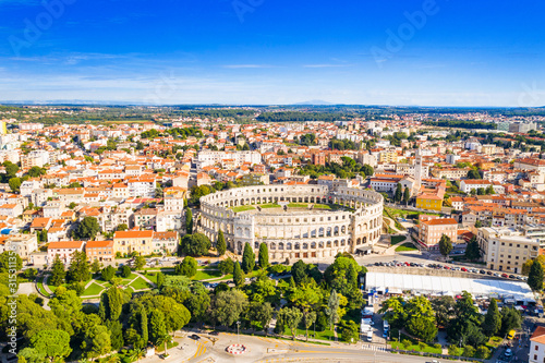 Croatia, city of Pula, ancient Roman arena, historic amphitheater and old town center from drone, aerial view