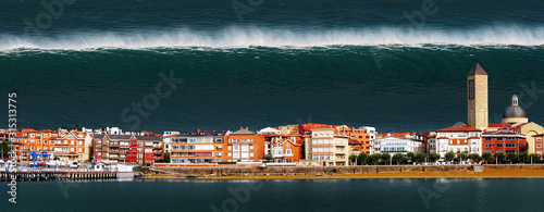 tsunami with a big wave crashing a town in the coast