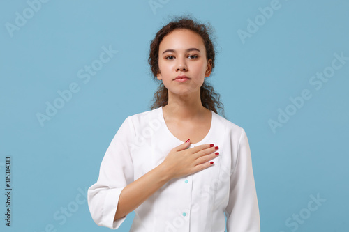 Принти на полотні African american doctor woman isolated on blue background studio portrait
