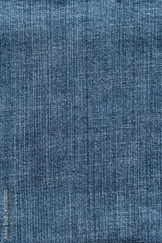 Blue denim textured background. Closeup texture and pattern of jeans fabric