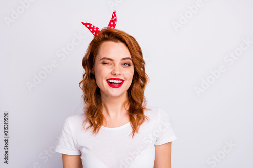 Portrait of lucky cute pretty woman wink blink enjoy summer free time holiday wear casual style clothes isolated over white color background