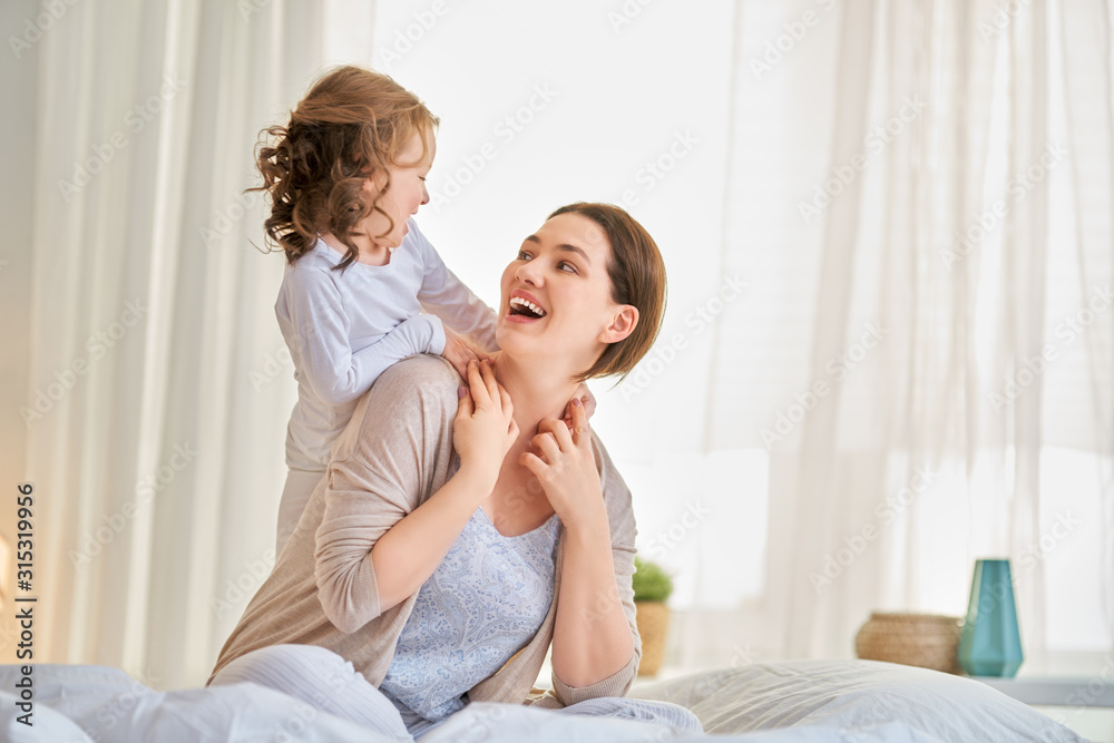 girl and her mother enjoy sunny morning girl and her mother enjoy sunny morning