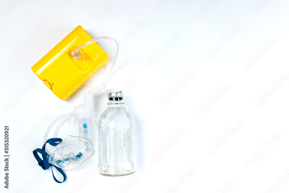 tube mask nebulizer and tubular transparent cable, saline on a white background, inhalation tube mask nebulizer and tubular transparent cable, saline on a white background, inhalation