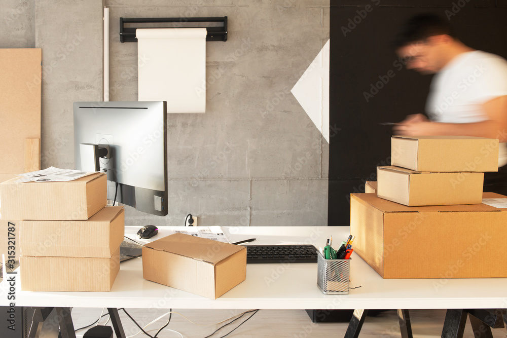 Fototapeta premium Delivery service, working in warehouse with packages 