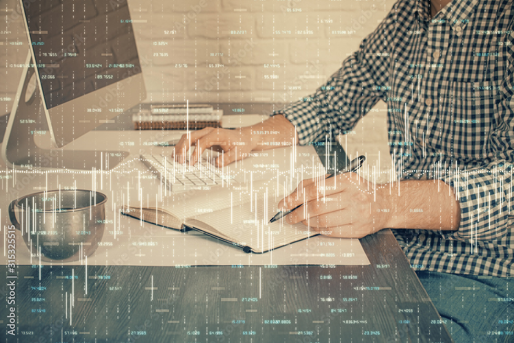 Double exposure of stock market chart with man working on computer on background. Concept of financial analysis. Double exposure of stock market chart with man working on computer on background. Concept of financial analysis.