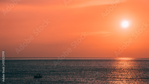 Sunset with a fishing boat, Cinque Terre, Italy © Paolo