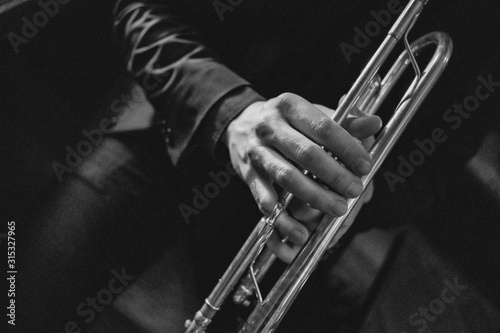 Close up of man playing trumpet photo