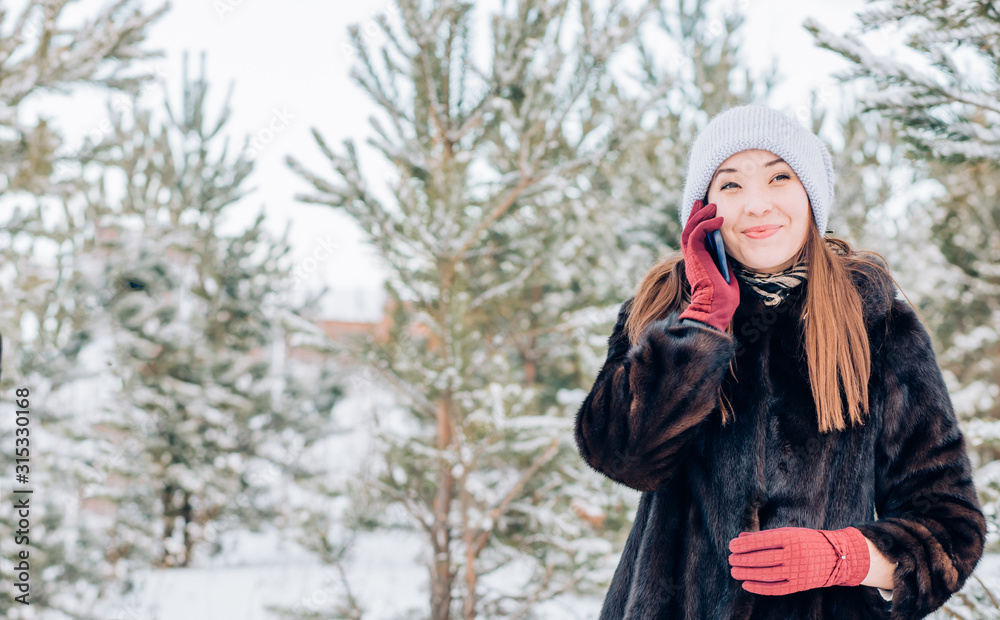 a woman using a smartphone in winter