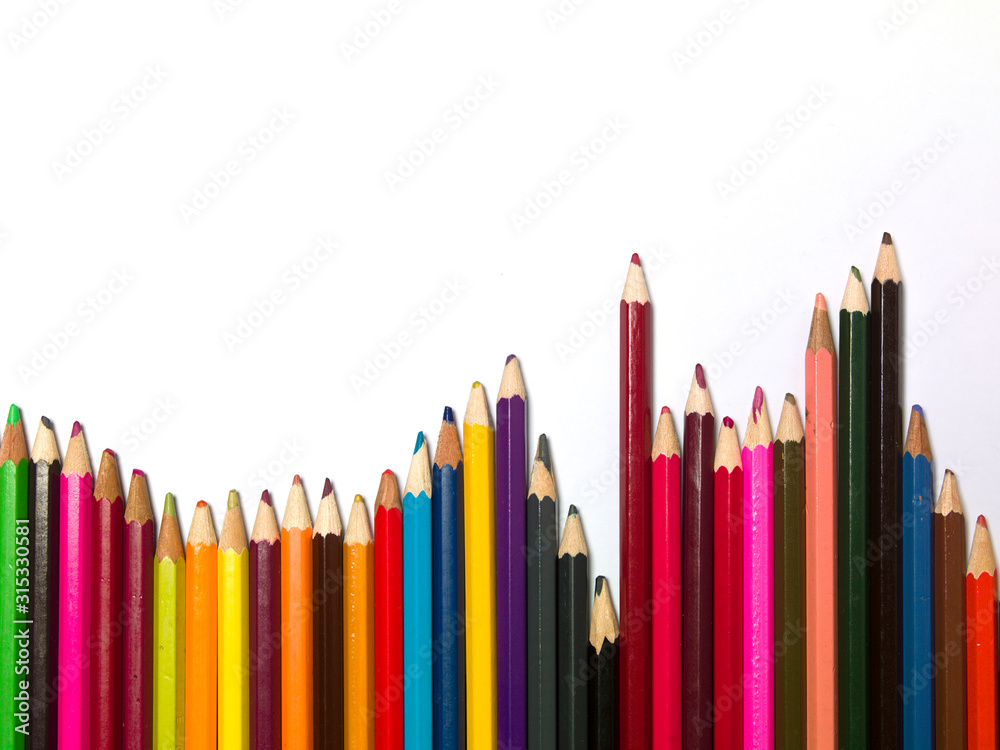 various colors of pencils on a white background, copy space various colors of pencils on a white background, copy space