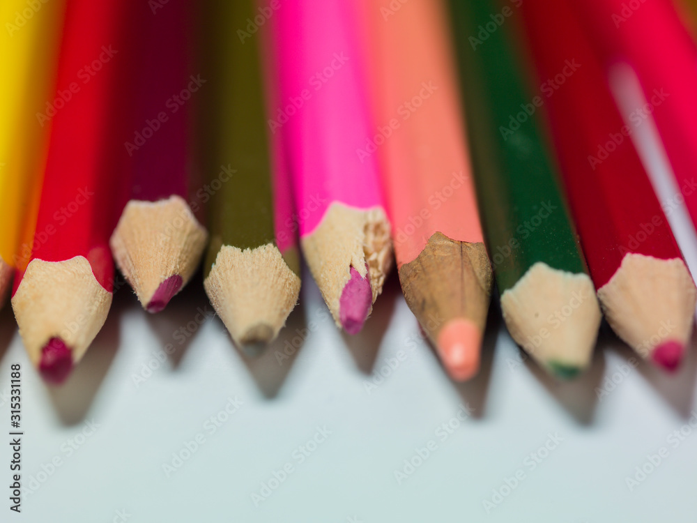 various colors of pencils on a white background, copy space various colors of pencils on a white background, copy space