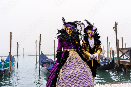Close-up of a costume reveller poses during the Carnival in Venice, Italy. © 1tomm
