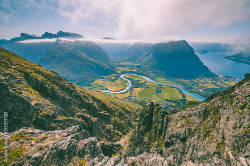 Hiking on the ridge of Romsdalseggen in Norway photo