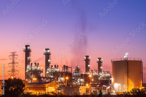 Power plant and oil refinery at sunrise