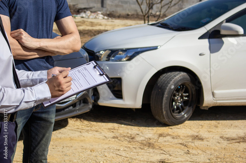 Car insurance agent, check for car accident damage damage , Fill out the claim form after the accident,traffic accident and insurance concept.