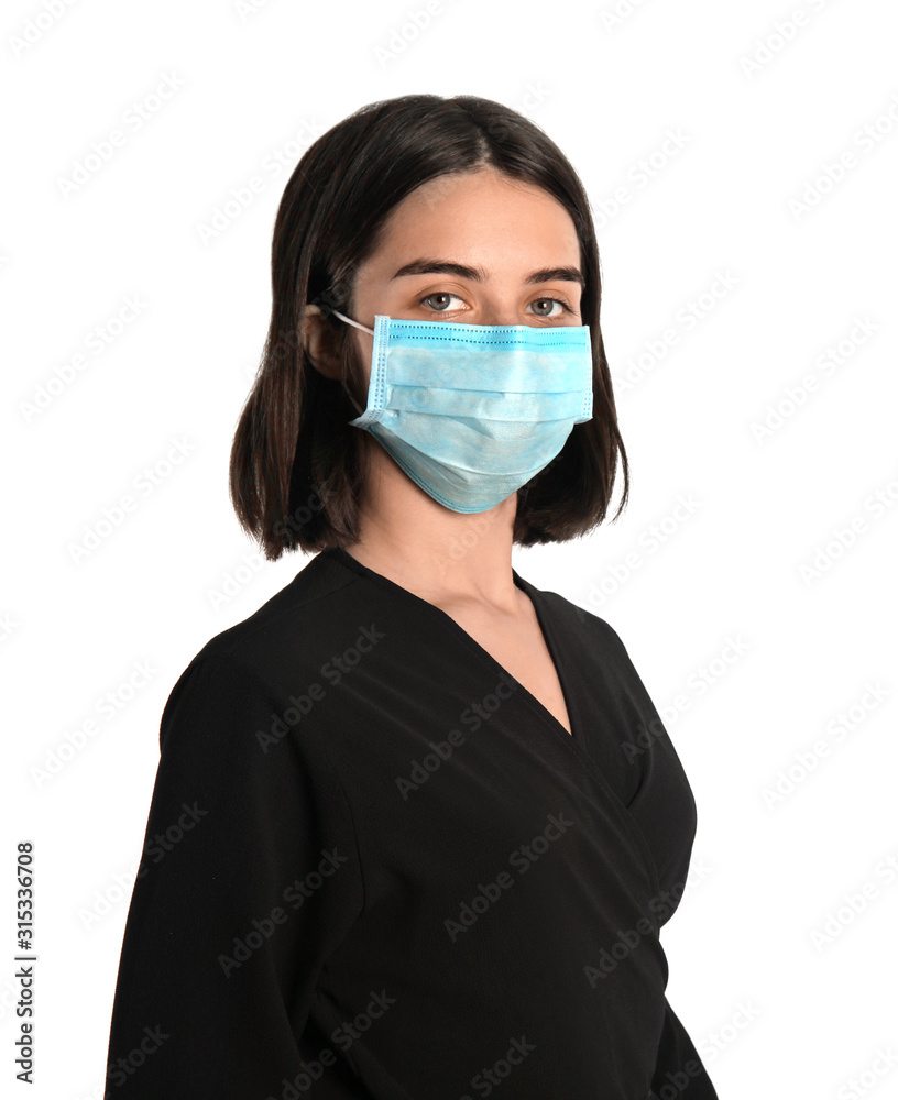 Woman with disposable mask on face against white background Woman with disposable mask on face against white background