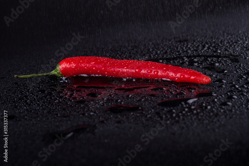 Cowhorn red pepper at its best. captivating pepper in the dark. Food concept.