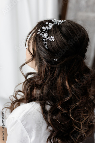 Bridal hairstyle close up, long curly brunette hair