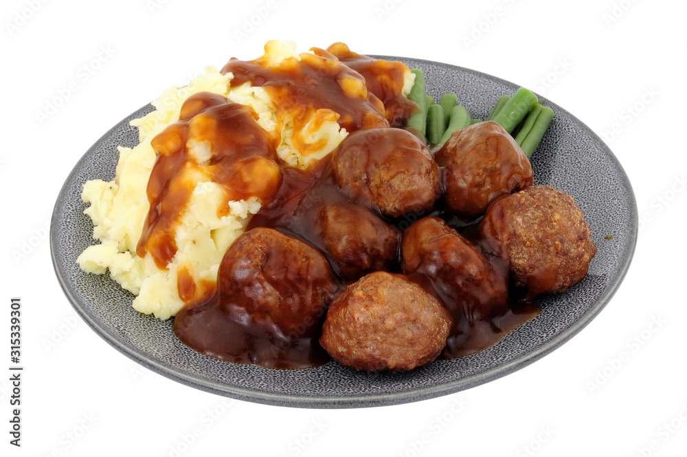 Beef meatballs and mashed potato meal with green beans and gravy