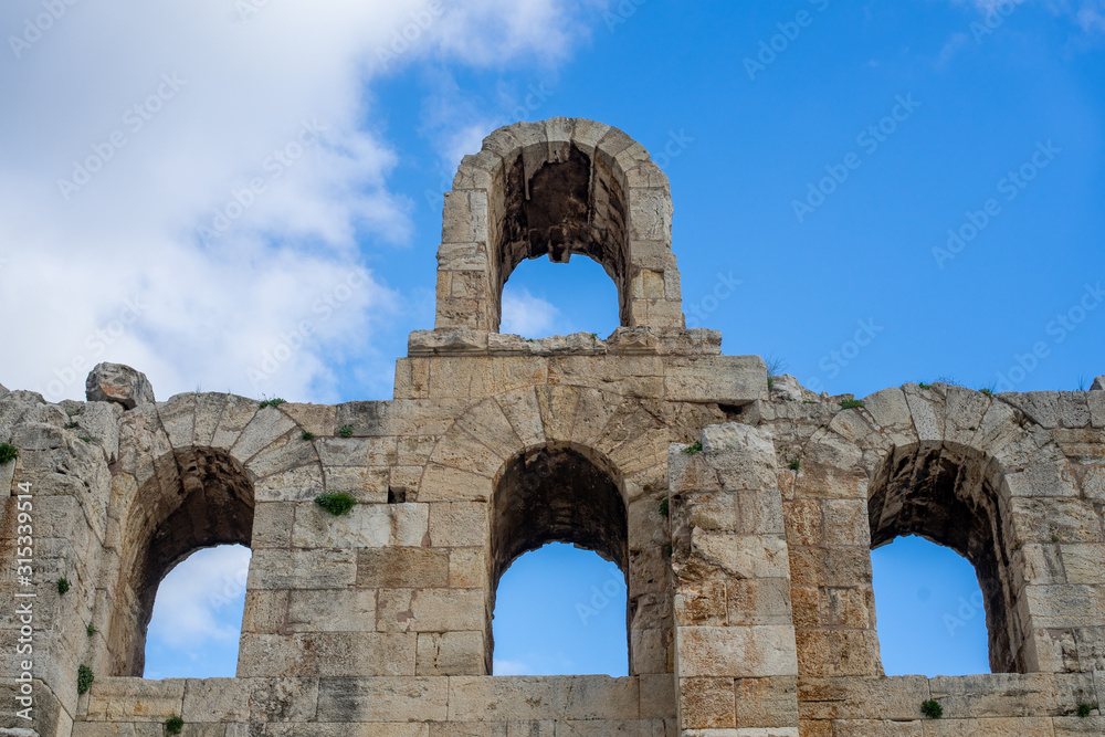 Odeon of Herodes Atticus facade detail in Athens, Greece. Also known as Herodeion is a stone Roman theater located on Acropolis hill slope.