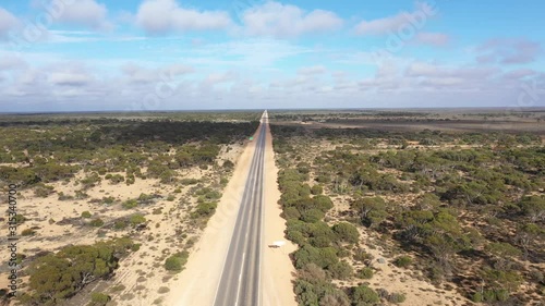 4K drone footage over the start of Australia's longest straight road (90miles) over the Nullarbor Plain in South Australia photo