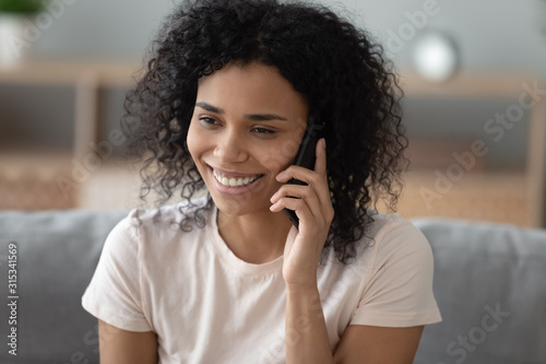 Close up of african woman smiling talking on phone