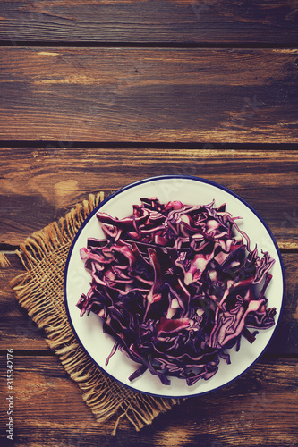 red cabbage on brown wooden surface