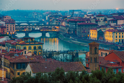 Florence Ponte Vecchio Bridge and City Skyline in Italy.
