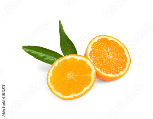 Halves of fresh ripe tangerine with leaves isolated on white. Citrus fruit