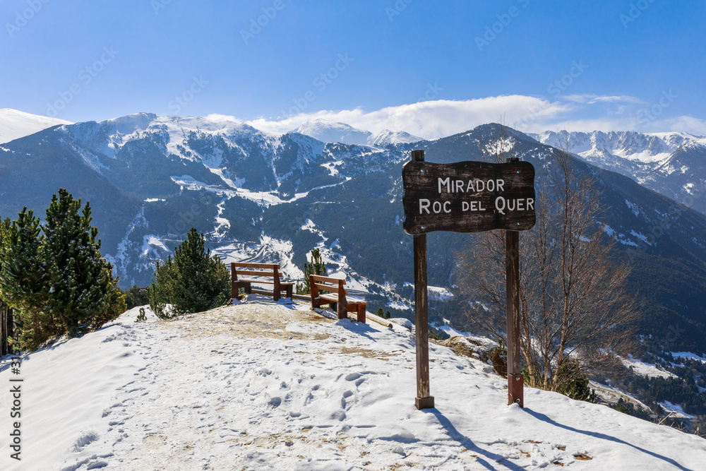 Idyllic relax viewpoint and winter snow landscape view in Mirador Roc del Quer, Andorra, Pyrenees mountains, South Europe. Andorra is famous tourist travel destination for skiing and winter rest