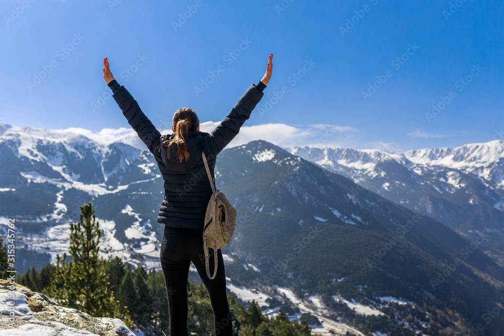 Young tourist woman has fun winter snow landscape mountain view in Andorra, Pyrenees mountains, Europe. Andorra is nice tourist travel destination. Luxury amazing resort for skiing and winter travel Young tourist woman has fun winter snow landscape mountain view in Andorra, Pyrenees mountains, Europe. Andorra is nice tourist travel destination. Luxury amazing resort for skiing and winter travel
