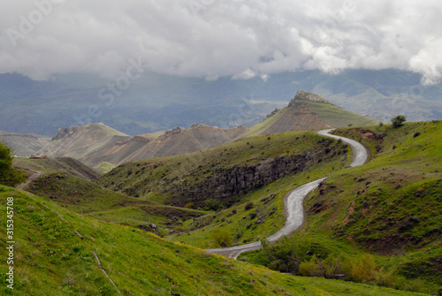 Mountainous landscape with cloudy sky. View from Medieval Tanahat Monastery. Vayots Dzor Region, Armenia. photo