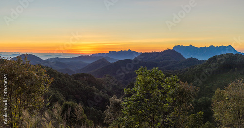 Panoramic landscape mountain layers line at morning colorful sky background,