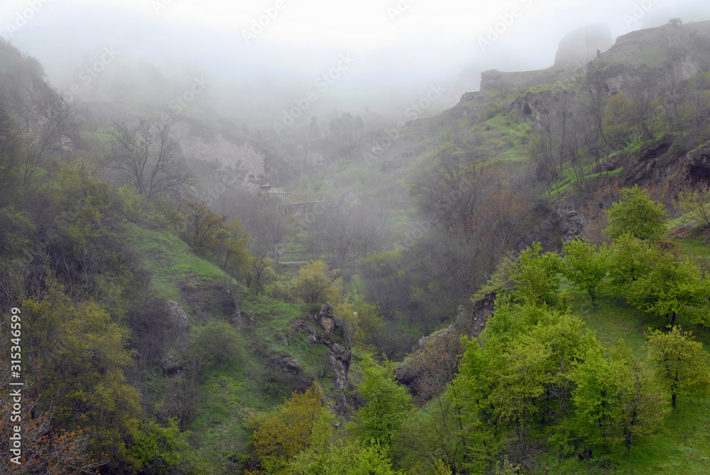 Foggy landscape. Old Khndzoresk town. Syunik Region, Armenia.