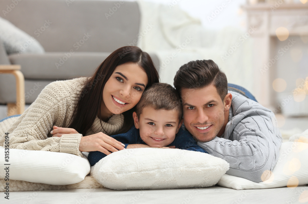 Fototapeta premium Happy family with little son spending time together at home. Winter vacation