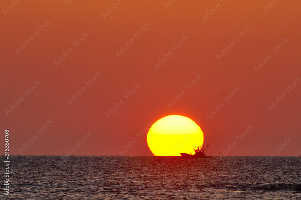 The morning sun and fishing boat. The morning sun and fishing boat.