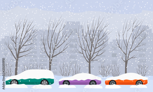 The road swept through the city after heavy snow and hail. parked cars on the street in snowdrifts and snow.