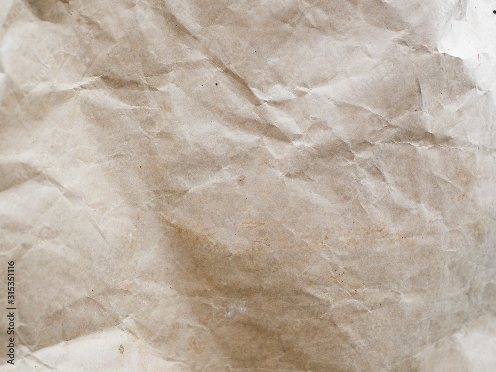 Crumpled kraft paper close-up. Background made of paper. Background texture. Crumpled kraft paper close-up. Background made of paper. Background texture.